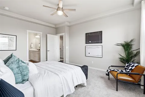 a bedroom with a bed and a couch