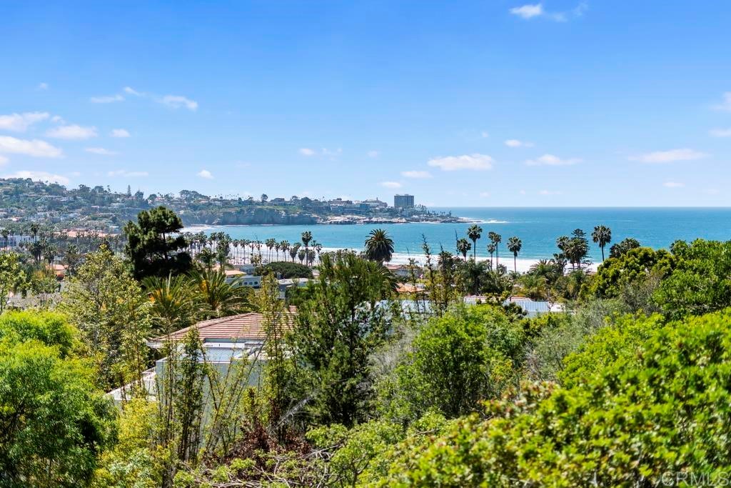8606 Ruette Monte Carlo La Jolla, CA 92037 - Photo 1 of 13 a view of a lake with a building in front of it
