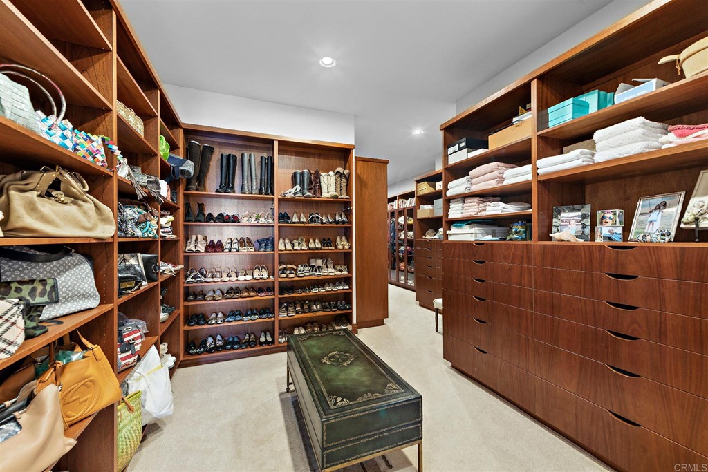 8606 Ruette Monte Carlo La Jolla, CA 92037 - Photo 11 of 13 walk in closet with clothes and shoes