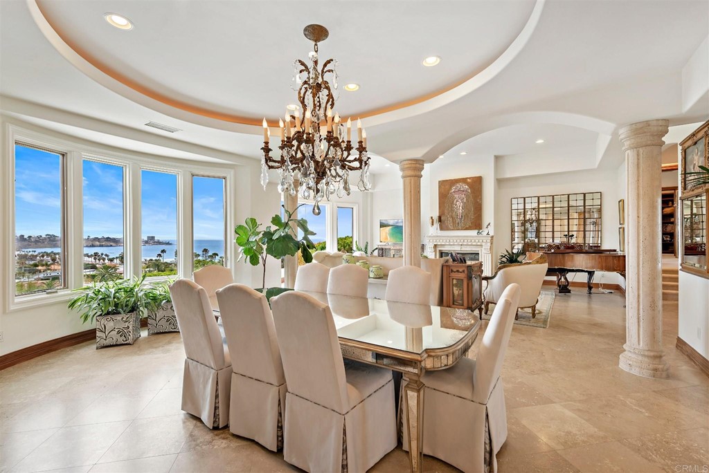 8606 Ruette Monte Carlo La Jolla, CA 92037 - Photo 3 of 13 a view of a dining room with furniture window and wooden floor