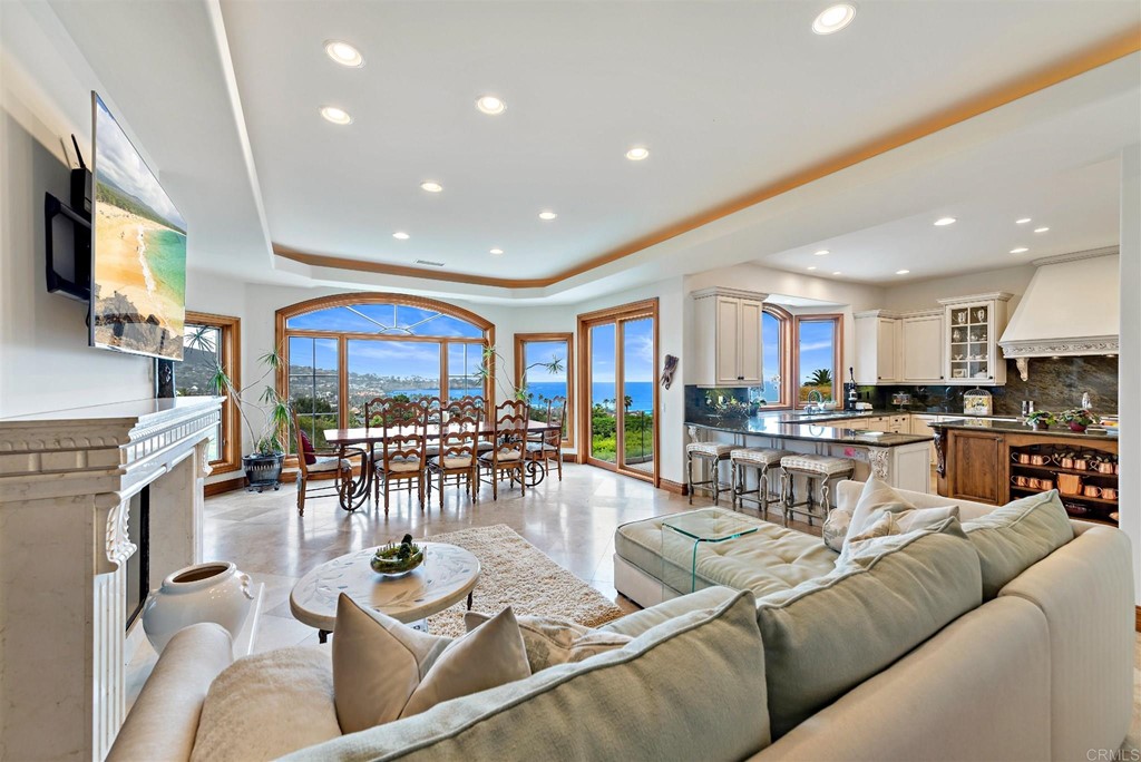 8606 Ruette Monte Carlo La Jolla, CA 92037 - Photo 7 of 13 a living room with furniture kitchen view and a large window