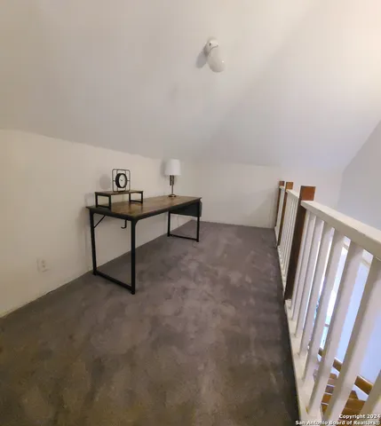 a view of room with window and stairs