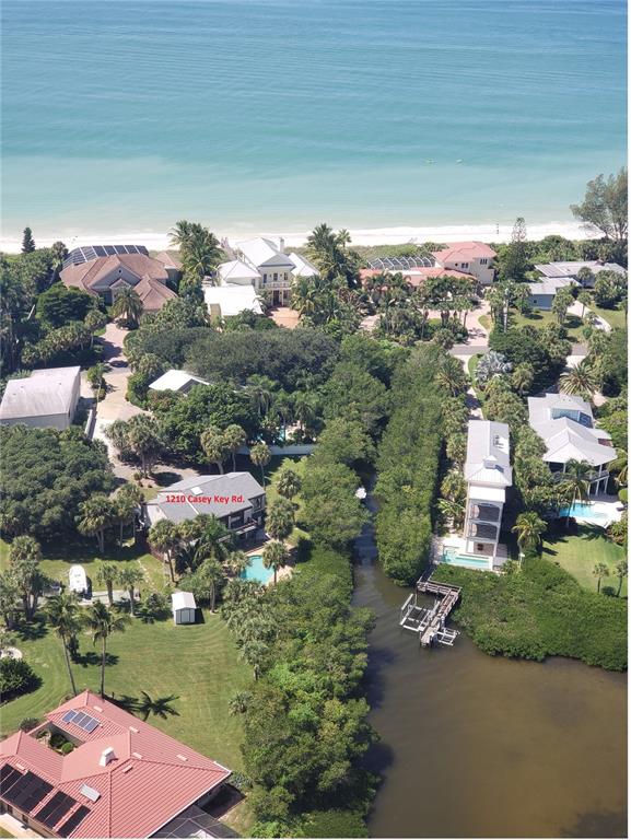 1210 Casey Key Road Nokomis, FL 34275 - Photo 8 of 22 an aerial view of a house with a yard basket ball court and outdoor seating