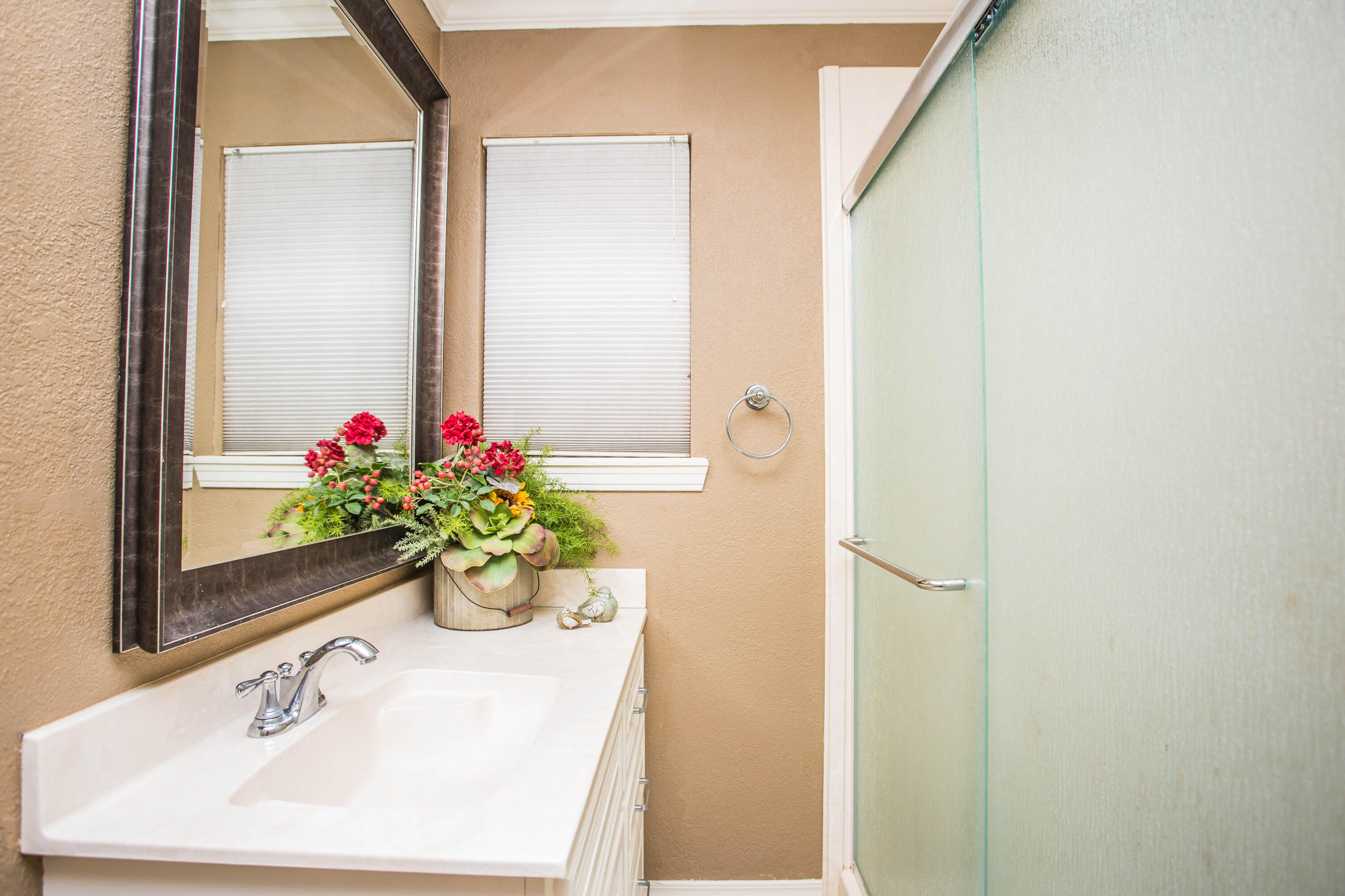 1304 Jefferson Drive Plainview, TX 79072 - Photo 29 of 50 a bathroom with a sink and a mirror