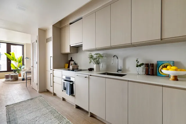 a kitchen with stainless steel appliances granite countertop a refrigerator sink and cabinets