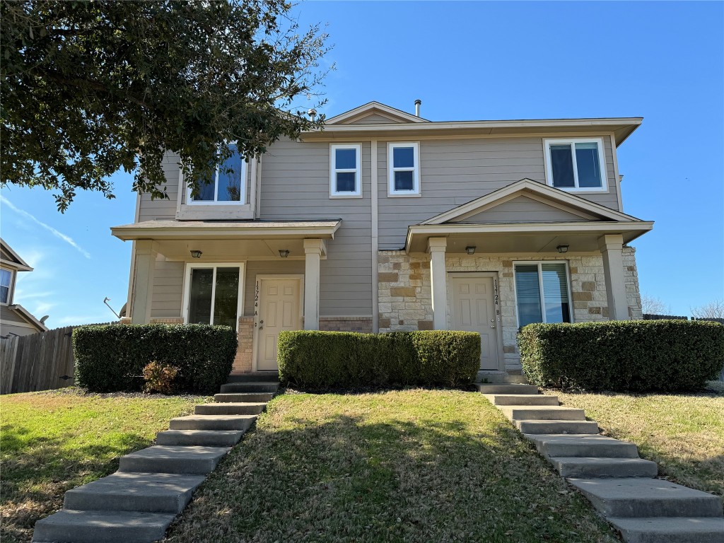 13724 Harris Ridge Boulevard, Unit A Pflugerville, TX 78660 - Photo 1 of 1 a front view of a house with a yard