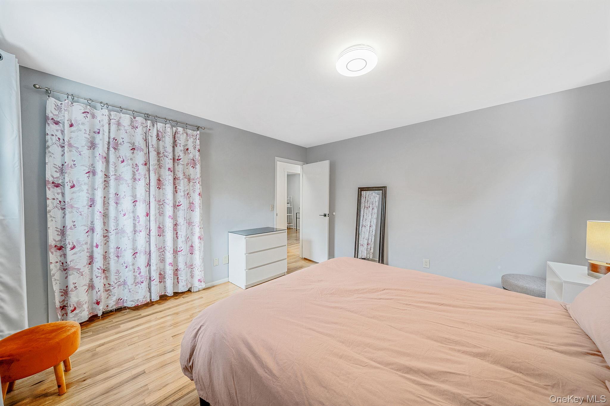 1663 Claas Avenue Holbrook, NY 11741 - Photo 12 of 28 a bedroom with a large bed and a closet