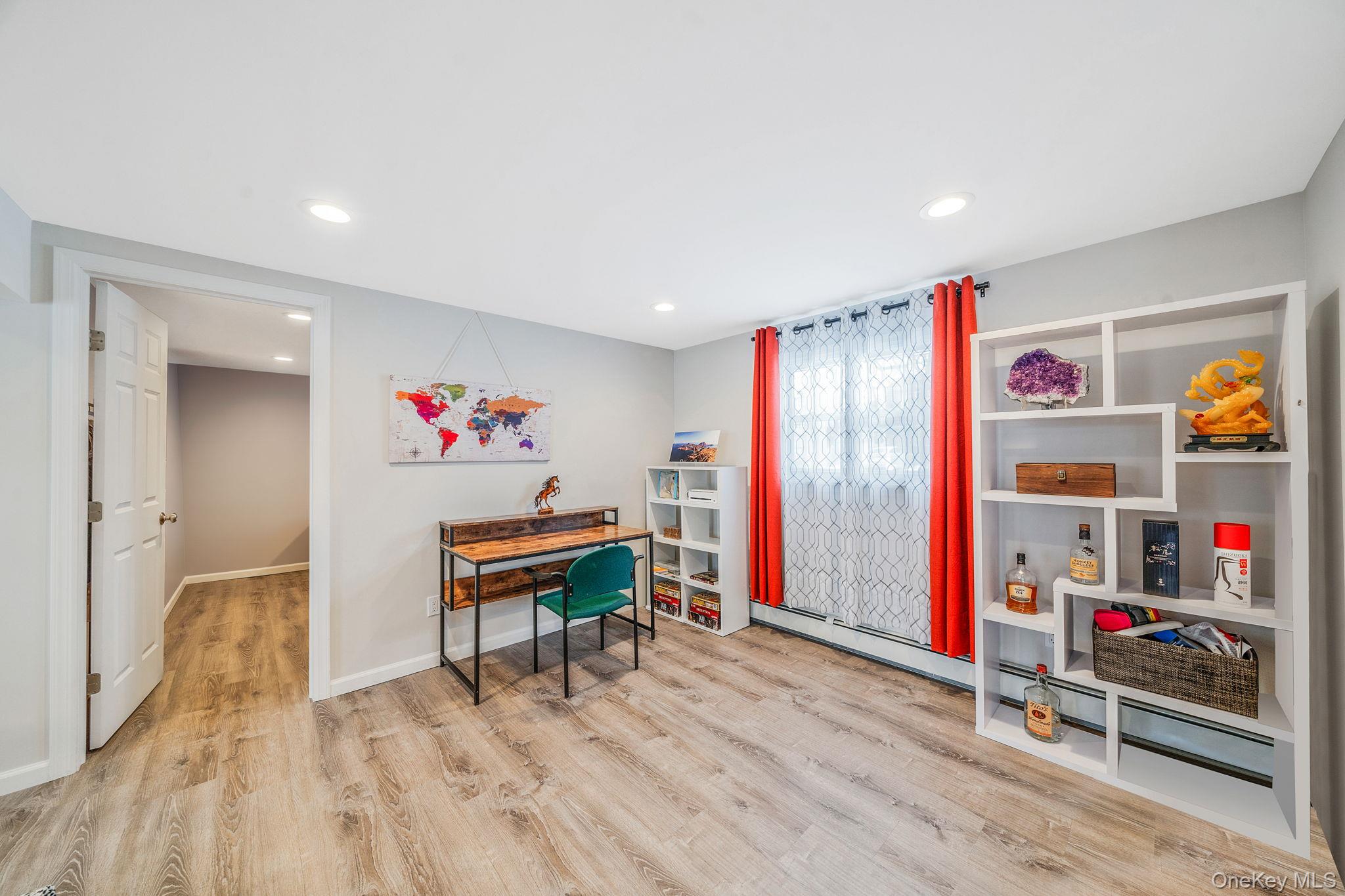 1663 Claas Avenue Holbrook, NY 11741 - Photo 19 of 28 a living room with furniture and a wooden floor