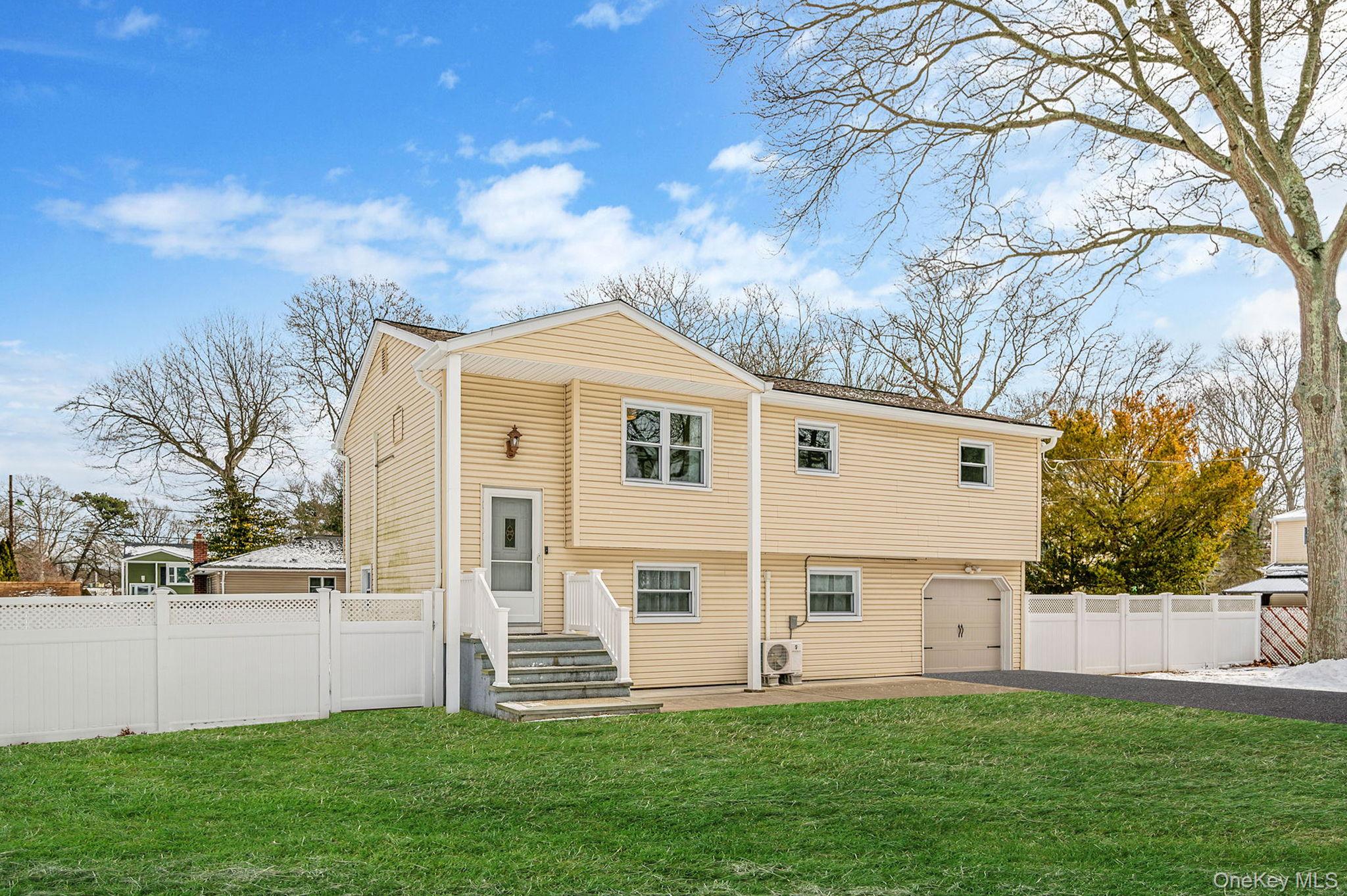 1663 Claas Avenue Holbrook, NY 11741 - Photo 2 of 28 a view of a house with a yard