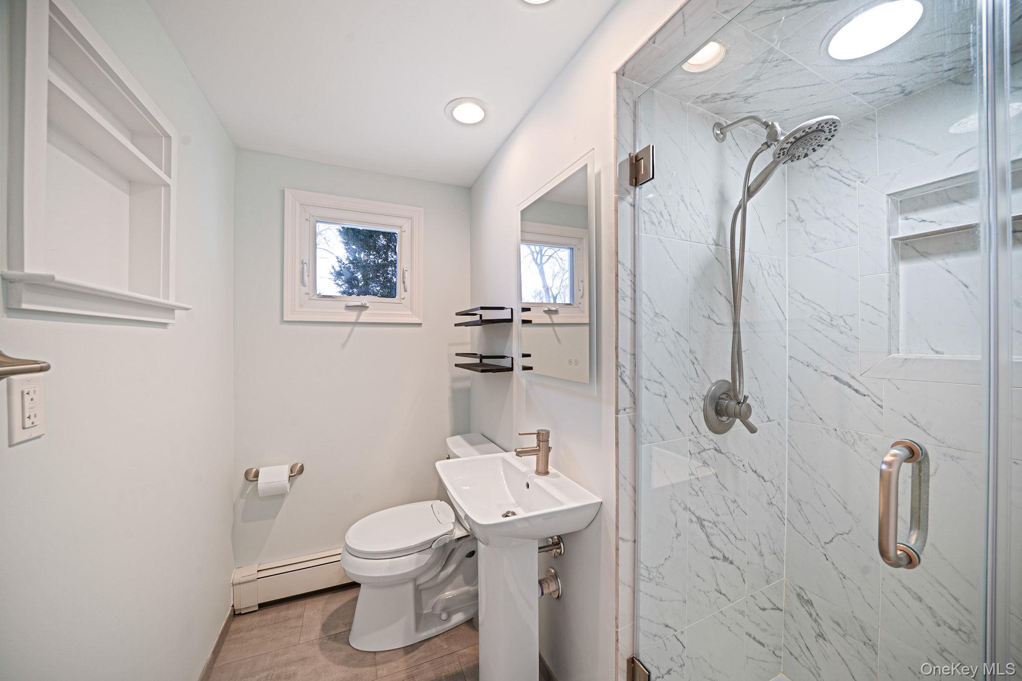 1663 Claas Avenue Holbrook, NY 11741 - Photo 21 of 28 a bathroom with a toilet sink and shower