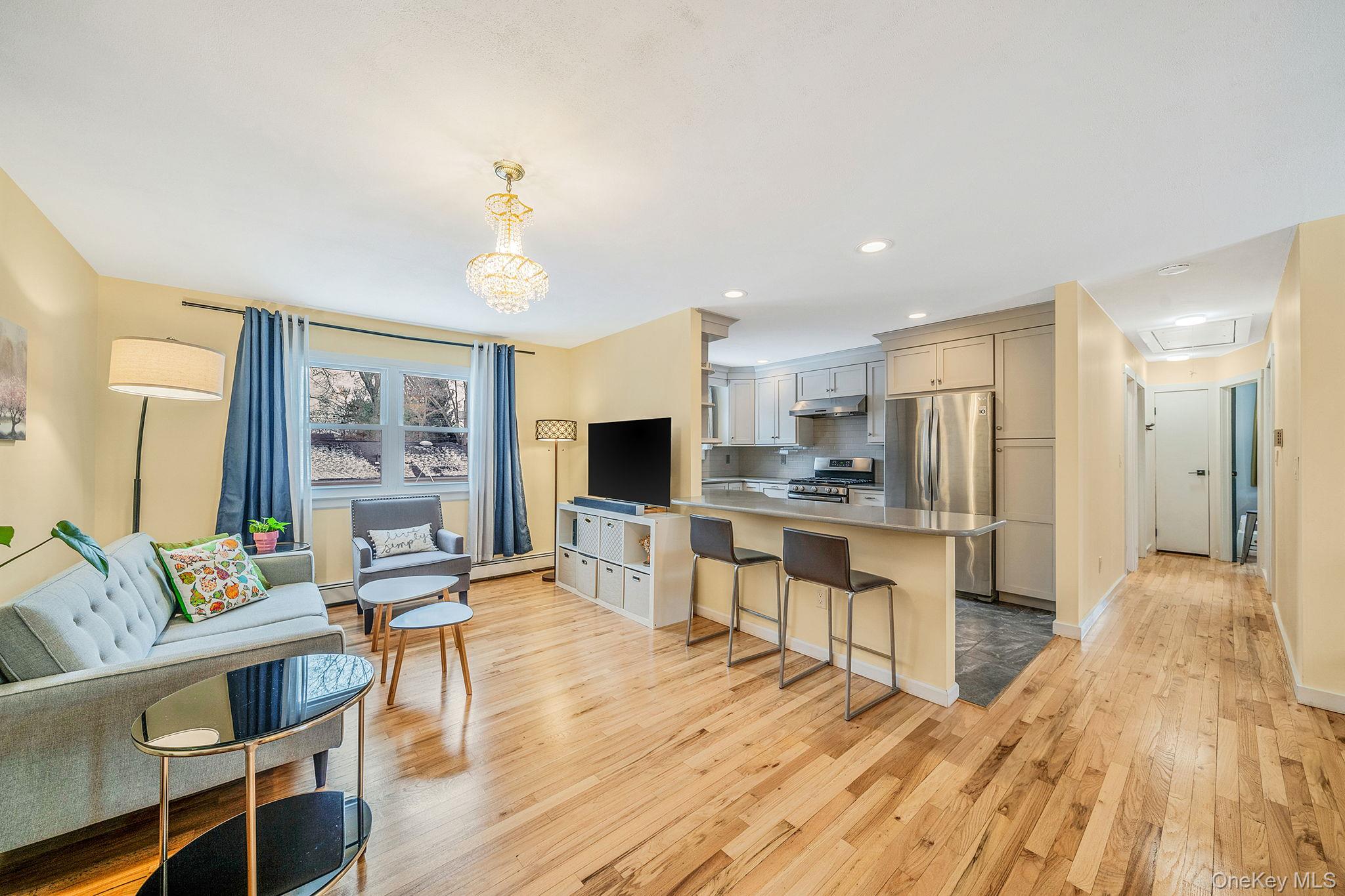1663 Claas Avenue Holbrook, NY 11741 - Photo 3 of 28 a open kitchen with white cabinets and stainless steel appliances