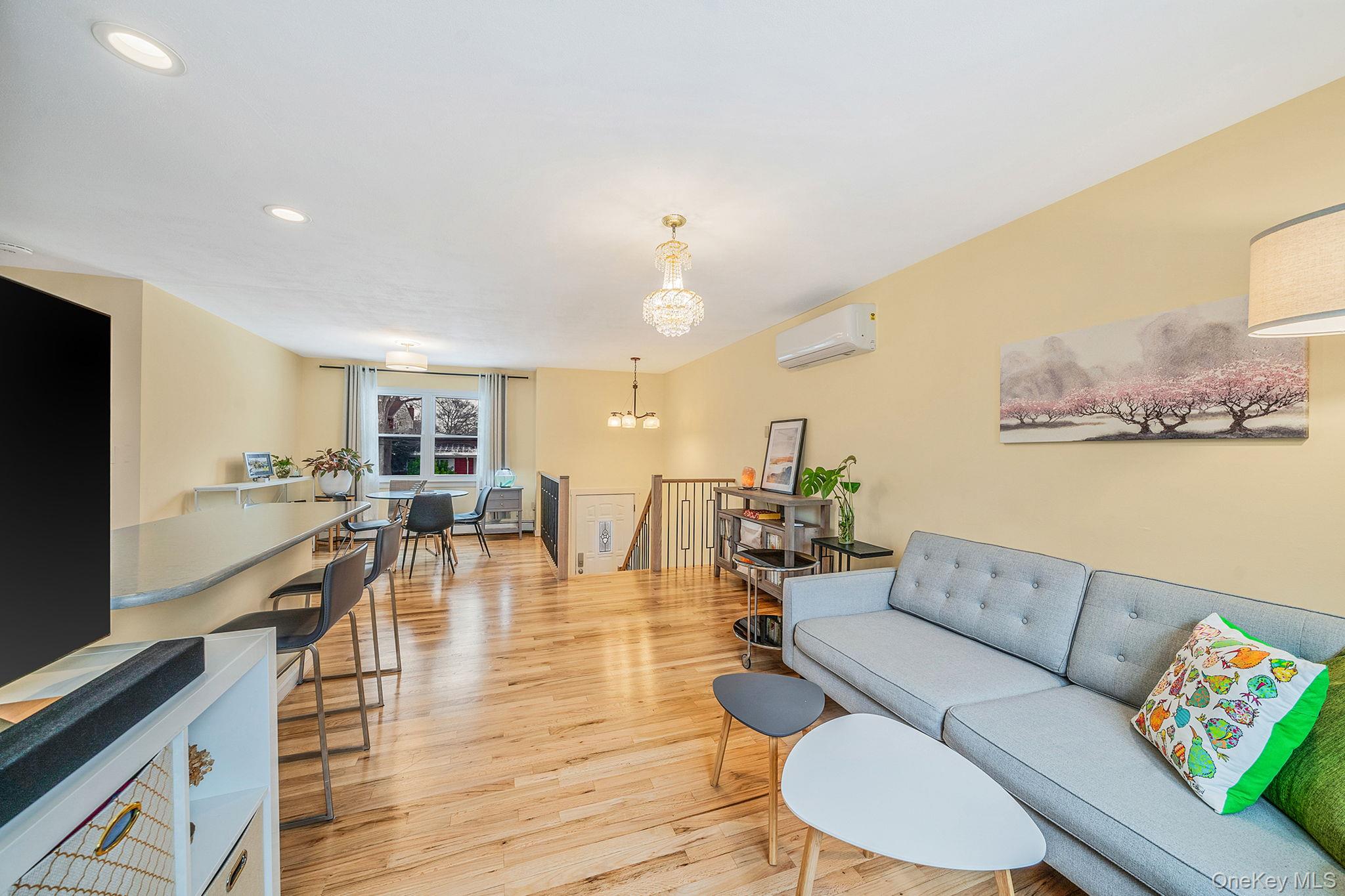1663 Claas Avenue Holbrook, NY 11741 - Photo 4 of 28 a living room with furniture and a flat screen tv