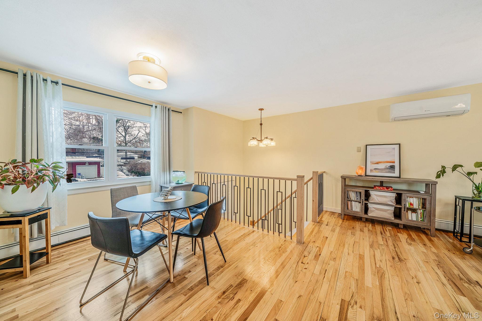 1663 Claas Avenue Holbrook, NY 11741 - Photo 9 of 28 a dining room with furniture and wooden floor