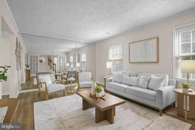 a living room with furniture and a table