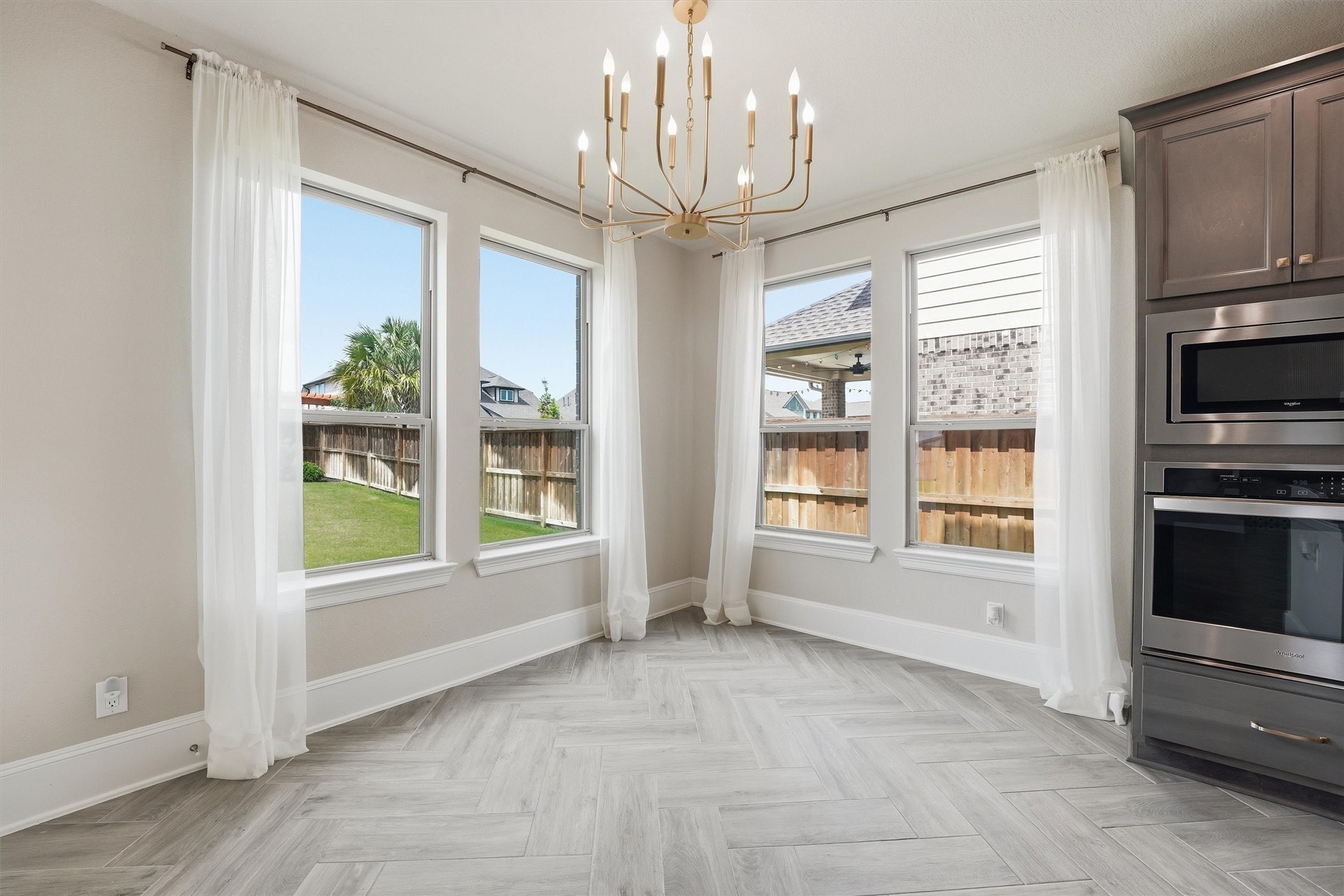 8673 Burdekin Road Magnolia, TX 77354 - Photo 20 of 50 New chandelier coordiantes w/ pendants and dining room lighting.