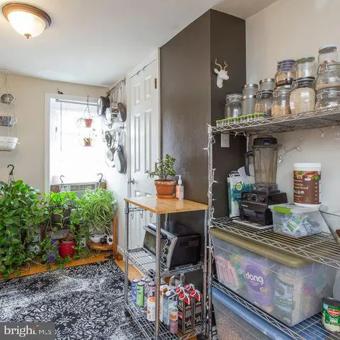 a kitchen with a white stove top oven and refrigerator