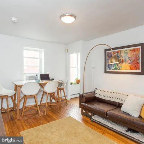 a view of a livingroom with furniture and a flat screen tv