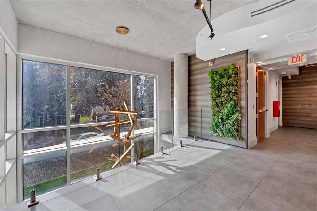 525 East Jackson Street Orlando, FL 32801 - Photo 12 of 65 a view of a room with gym equipment and floor to ceiling window