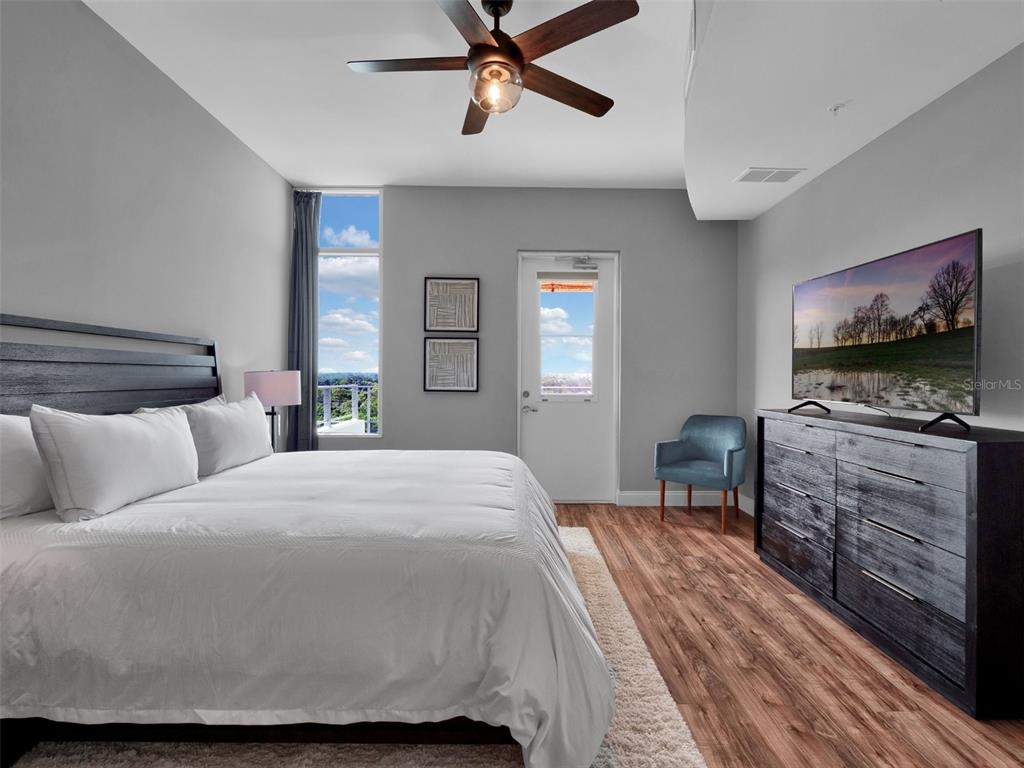 525 East Jackson Street Orlando, FL 32801 - Photo 22 of 65 a bedroom with a bed and furniture