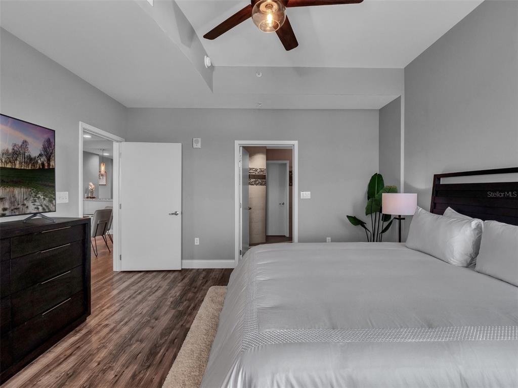 525 East Jackson Street Orlando, FL 32801 - Photo 24 of 65 a bedroom with a bed and dresser