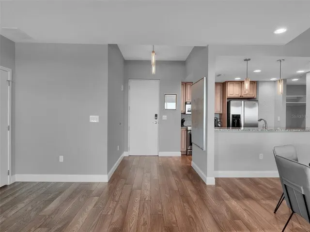 a kitchen with stainless steel appliances granite countertop a stove and a refrigerator