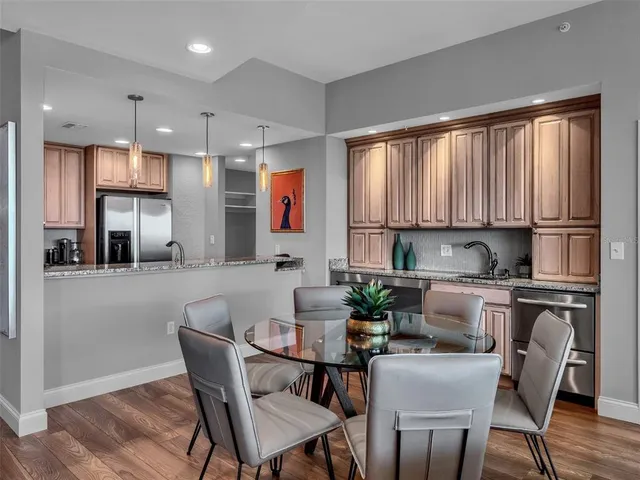 a view of a chairs and table in the balcony