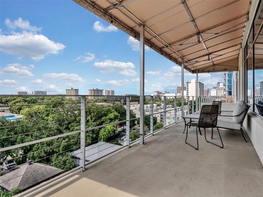 525 East Jackson Street Orlando, FL 32801 - Photo 45 of 65 a view of a chairs and table in the balcony