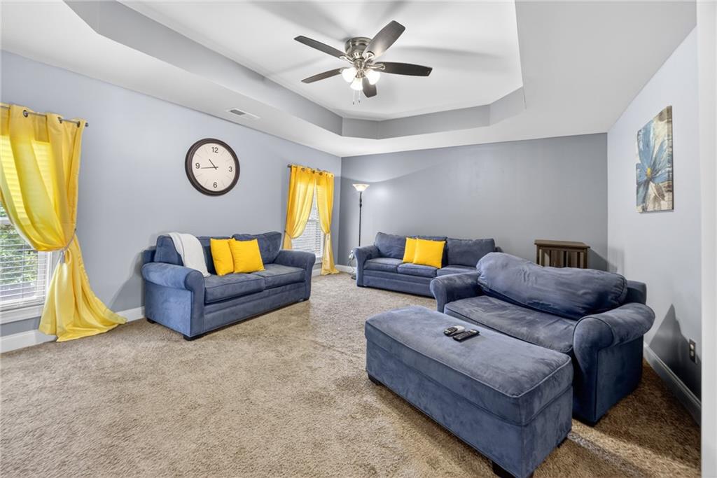 2300 Tucker Mill Road Southwest Conyers, GA 30094 - Photo 29 of 45 a living room with furniture and a flat screen tv