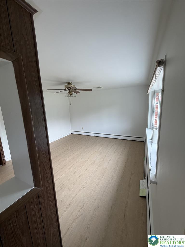 5391 Chapmans Road, Unit 2 Orefield, PA 18069 - Photo 11 of 22 A spacious room offers vinyl flooring and ample natural light from the large window.