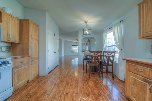 a dining room with furniture and wooden floor
