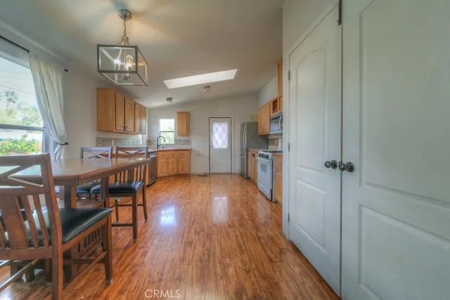 a view of a kitchen cabinets and wooden floor