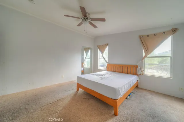 a room with a bed and window