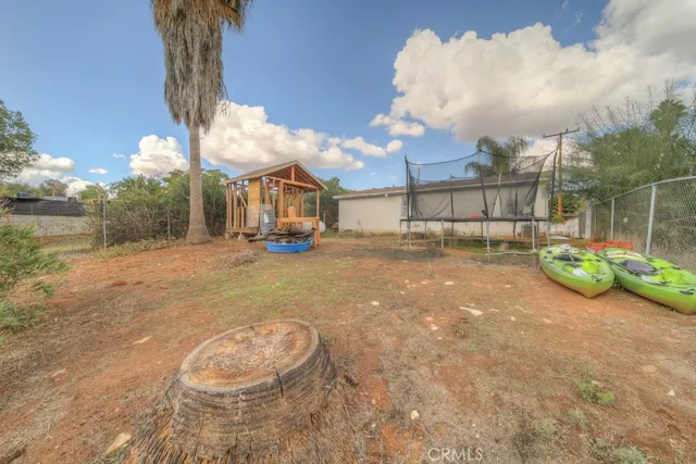 a view of a backyard of the house