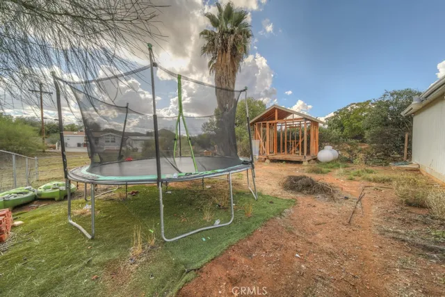 a small garden in the backyard of a house