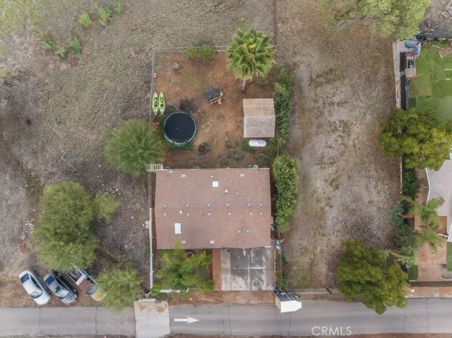 an aerial view of a house with outdoor space