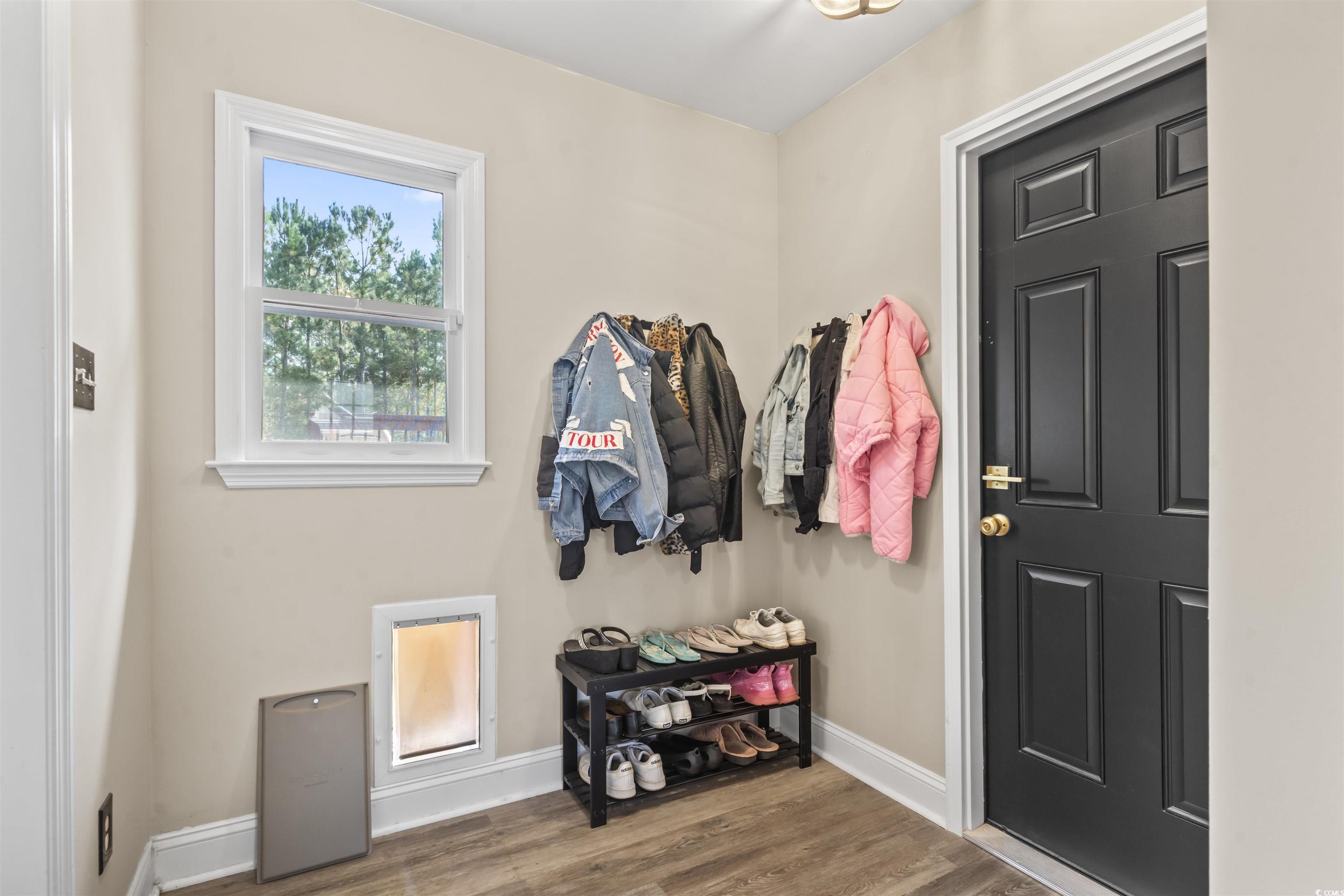 1495 Wilderness Lane Loris, SC 29569 - Photo 14 of 37 Entryway with wood finished floors and baseboards