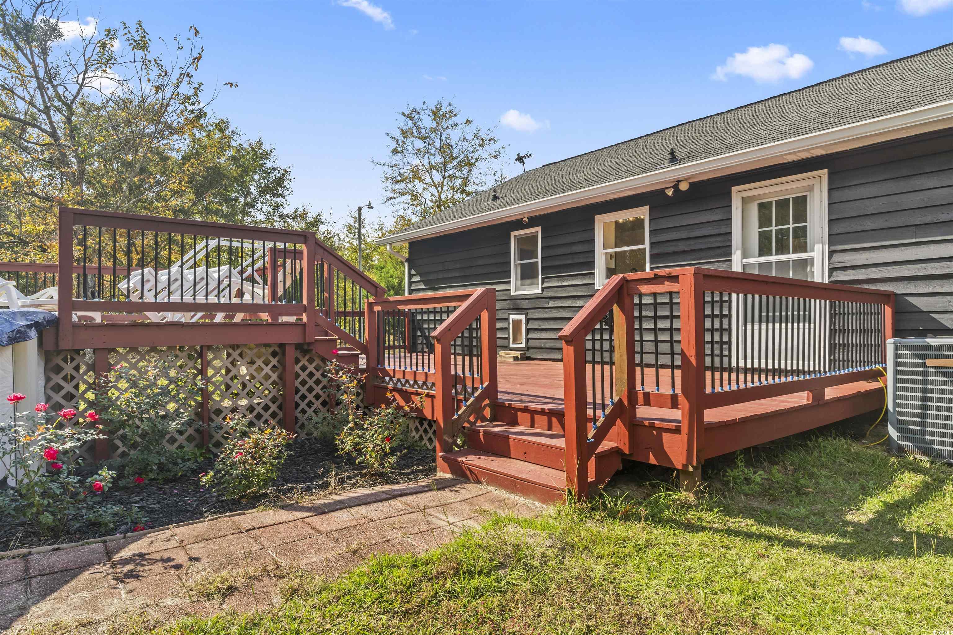 1495 Wilderness Lane Loris, SC 29569 - Photo 16 of 37 Wooden terrace featuring a yard