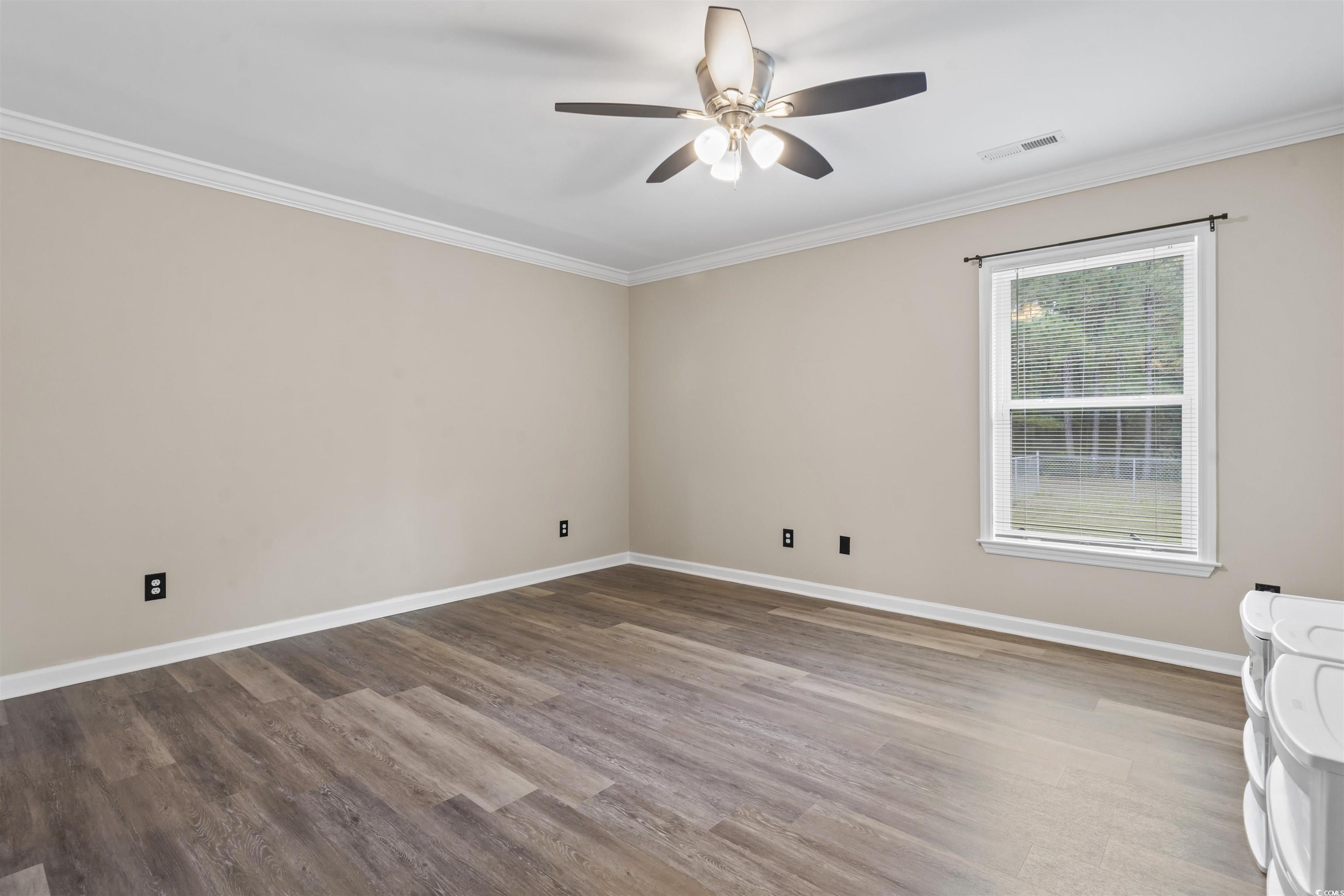 1495 Wilderness Lane Loris, SC 29569 - Photo 20 of 37 Entryway with ornamental molding and light wood finished floors
