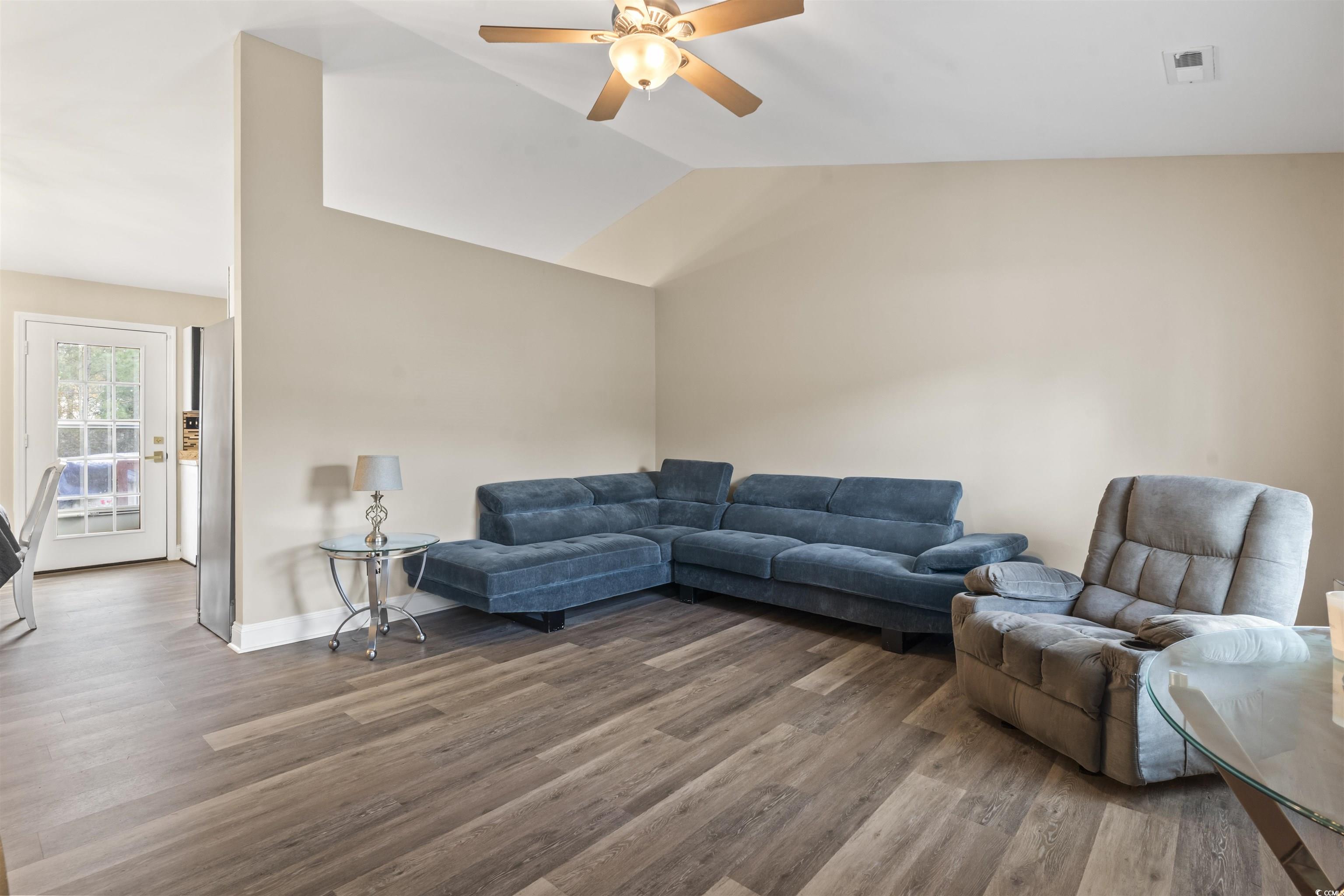 1495 Wilderness Lane Loris, SC 29569 - Photo 22 of 37 Unfurnished bedroom featuring ornamental molding, a walk in closet, light wood finished floors, and a ceiling fan
