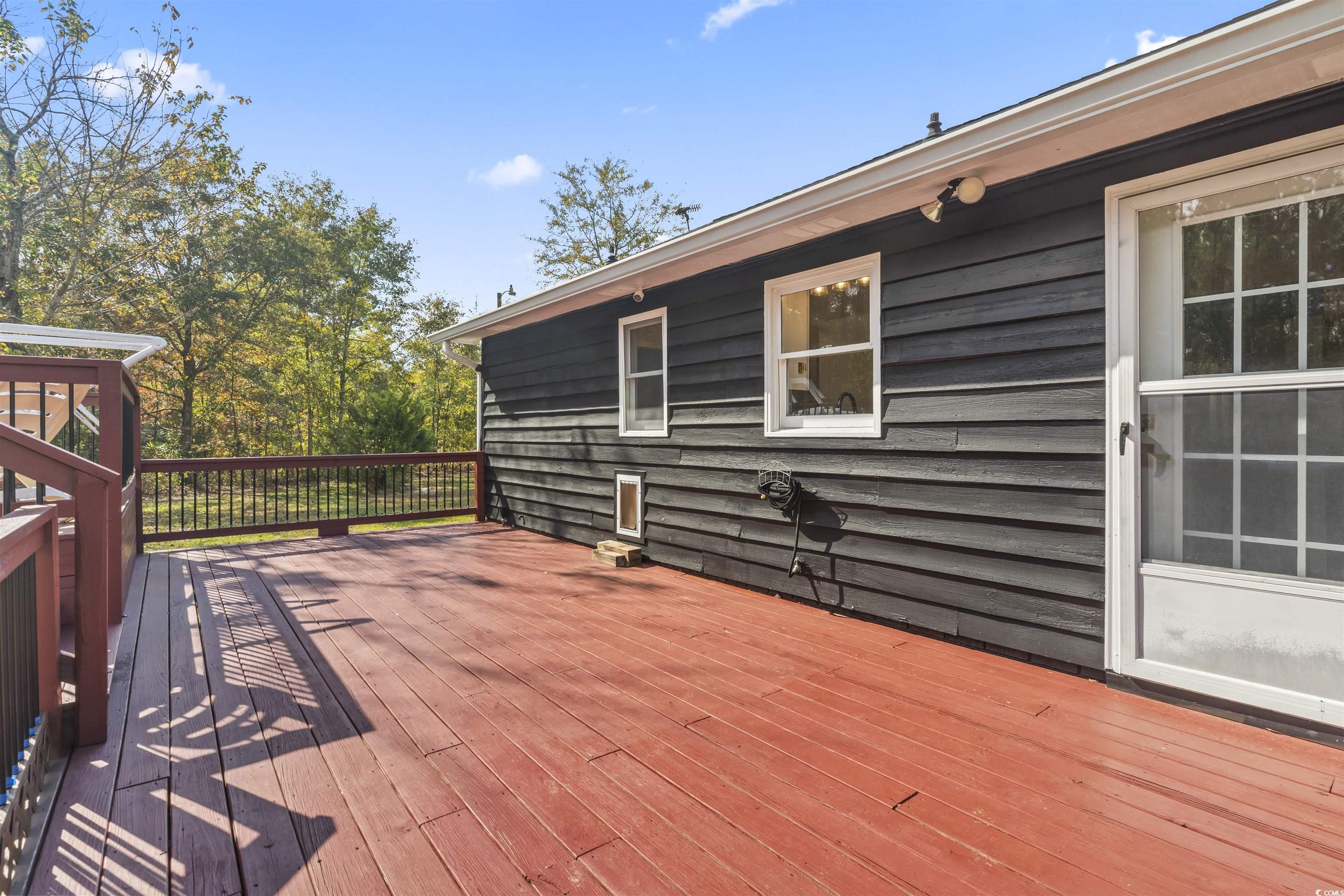 1495 Wilderness Lane Loris, SC 29569 - Photo 25 of 37 Living room with vaulted ceiling, wood finished floors, and a ceiling fan