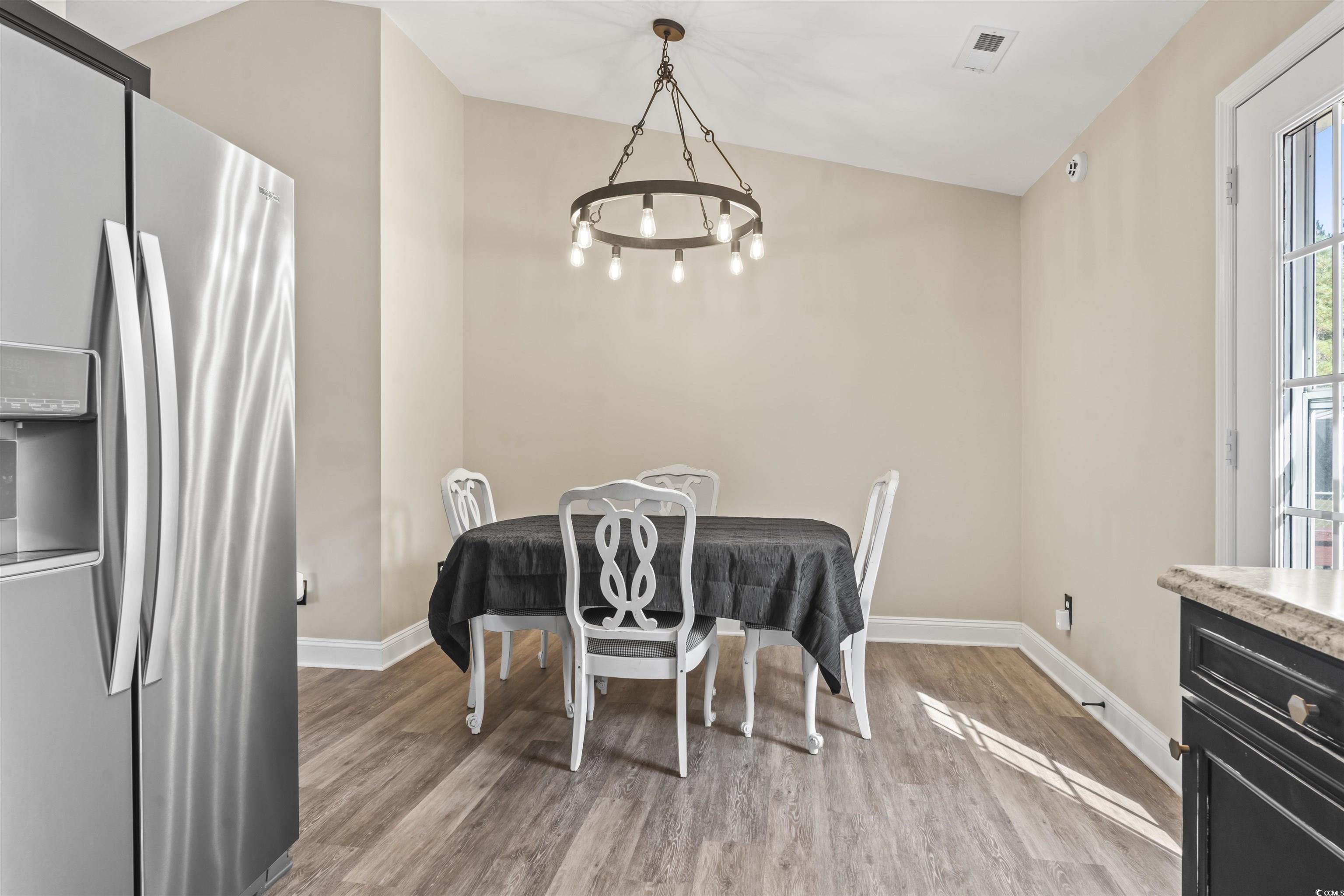 1495 Wilderness Lane Loris, SC 29569 - Photo 7 of 37 Dining room with light wood-style floors and lofted ceiling
