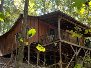 1438 Fall River Road Goodspring, TN 38460 - Photo 2 of 39 a backyard of a house with table and chairs