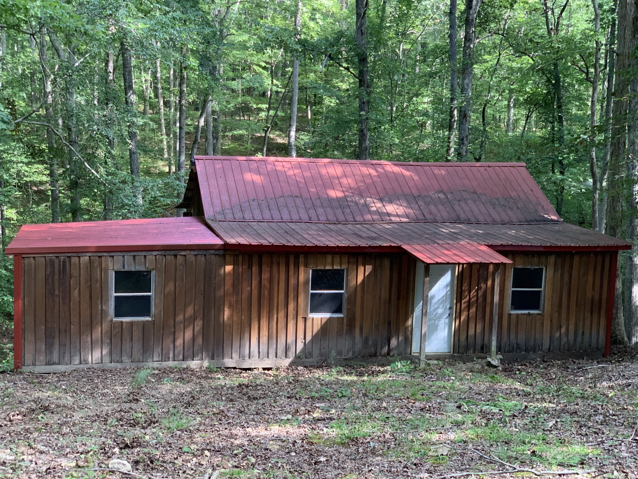 1438 Fall River Road Goodspring, TN 38460 - Photo 35 of 39 a view of barn with large trees and wooden fence
