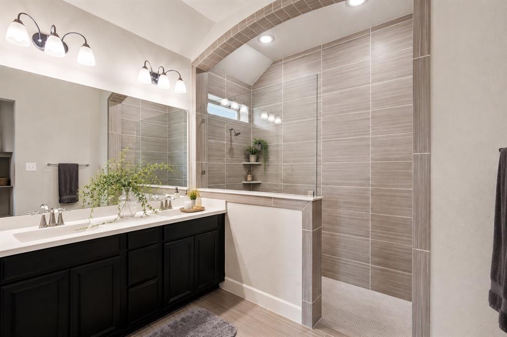 709 Bent Brook Road Oak Point, TX 75068 - Photo 14 of 20 Bathroom featuring a dual vanity with dark wood cabinetry, white countertops, and brushed nickel fixtures