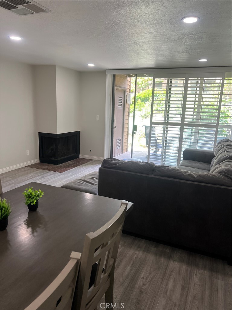 4140 Workman Mill Road, Unit 277 Whittier, CA 90601 - Photo 9 of 10 a living room with furniture and a potted plant