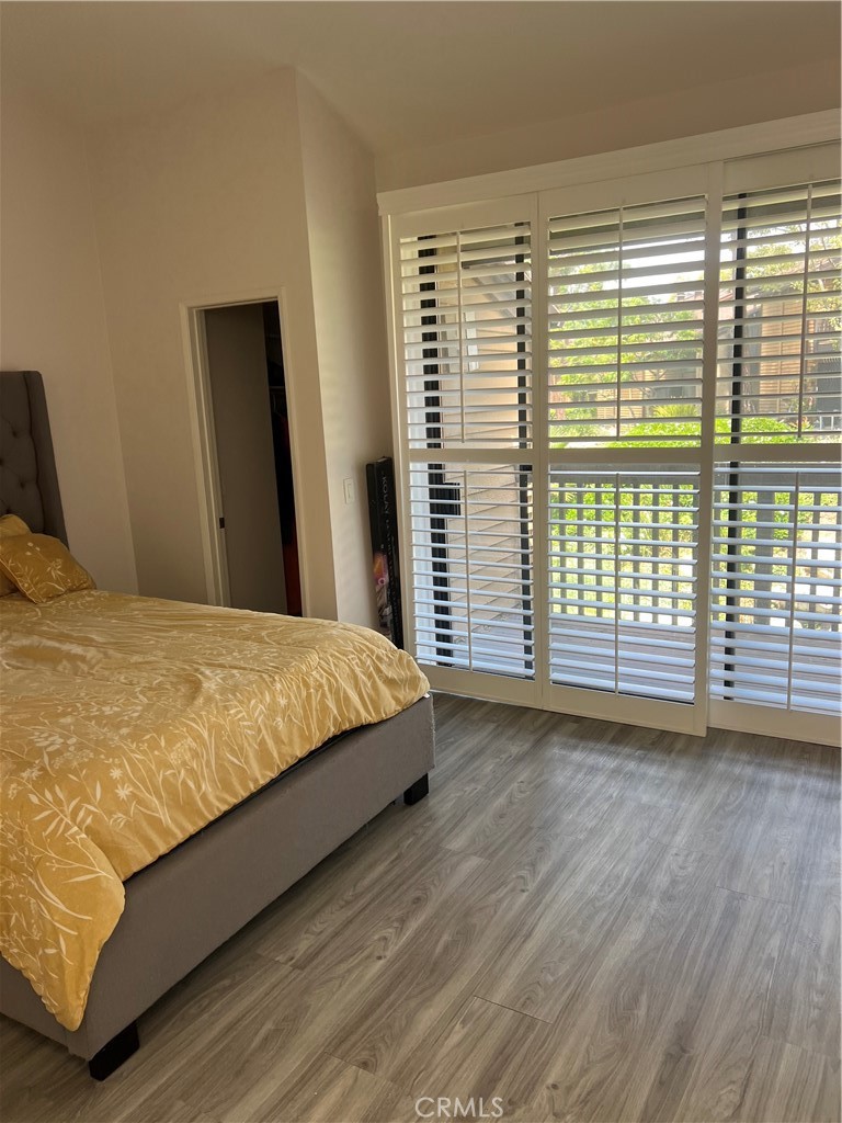 4140 Workman Mill Road, Unit 277 Whittier, CA 90601 - Photo 10 of 10 a large bed sitting in a bedroom next to a window