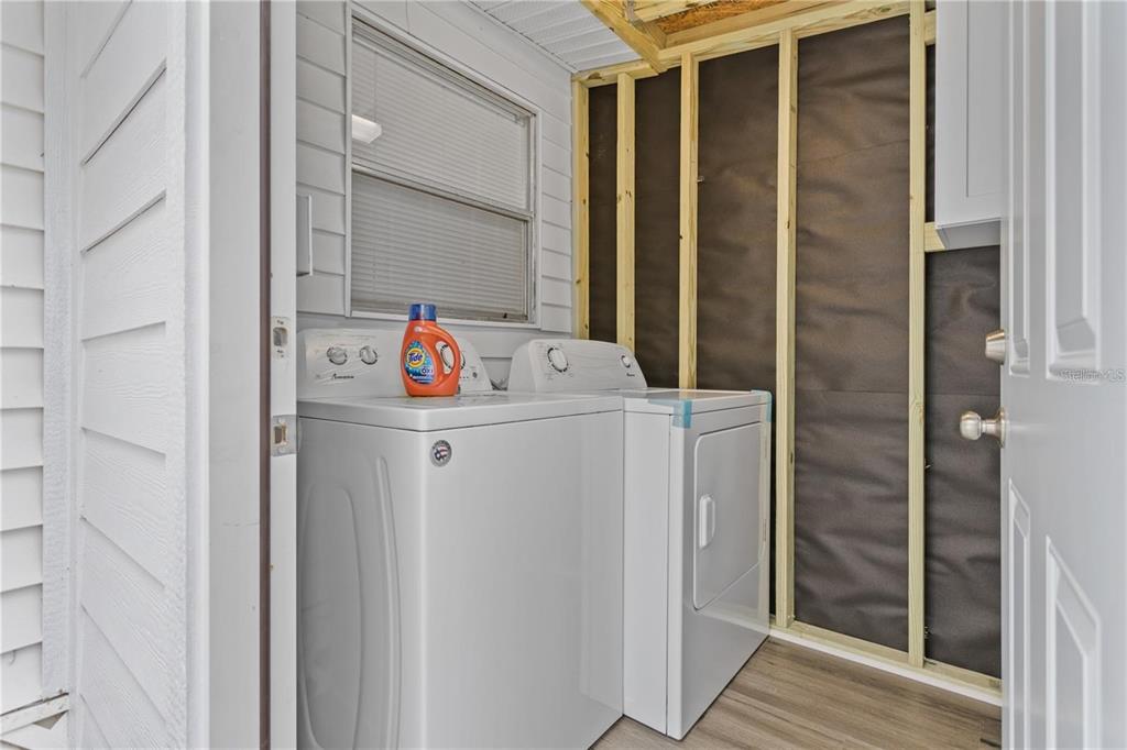 904 Lakeview Road, Unit A Clearwater, FL 33756 - Photo 25 of 25 a utility room with dryer and washer