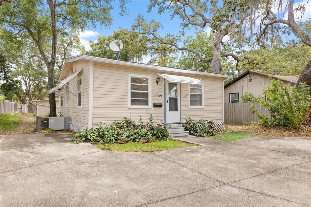 904 Lakeview Road, Unit A Clearwater, FL 33756 - Photo 5 of 25 a front view of a house with garden
