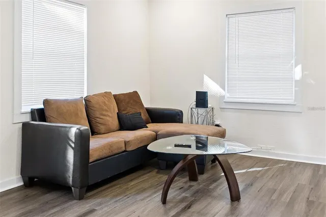 a living room with furniture and a window