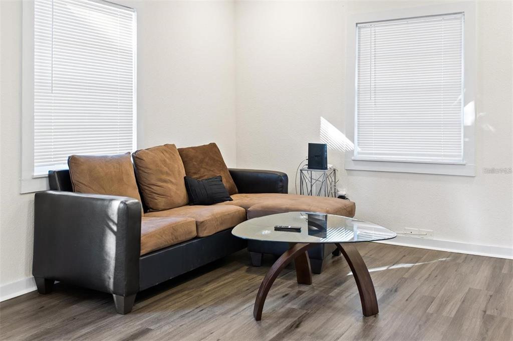 904 Lakeview Road, Unit A Clearwater, FL 33756 - Photo 6 of 25 a living room with furniture and a window